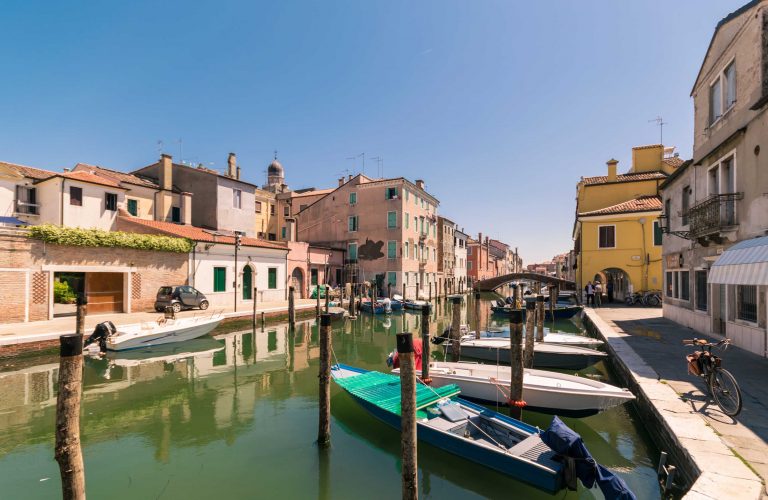 Characteristic canal in Chioggia, lagoon of Venice, Italy.